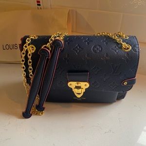 Monogram Empreinte leather, Louis Vuitton bag.